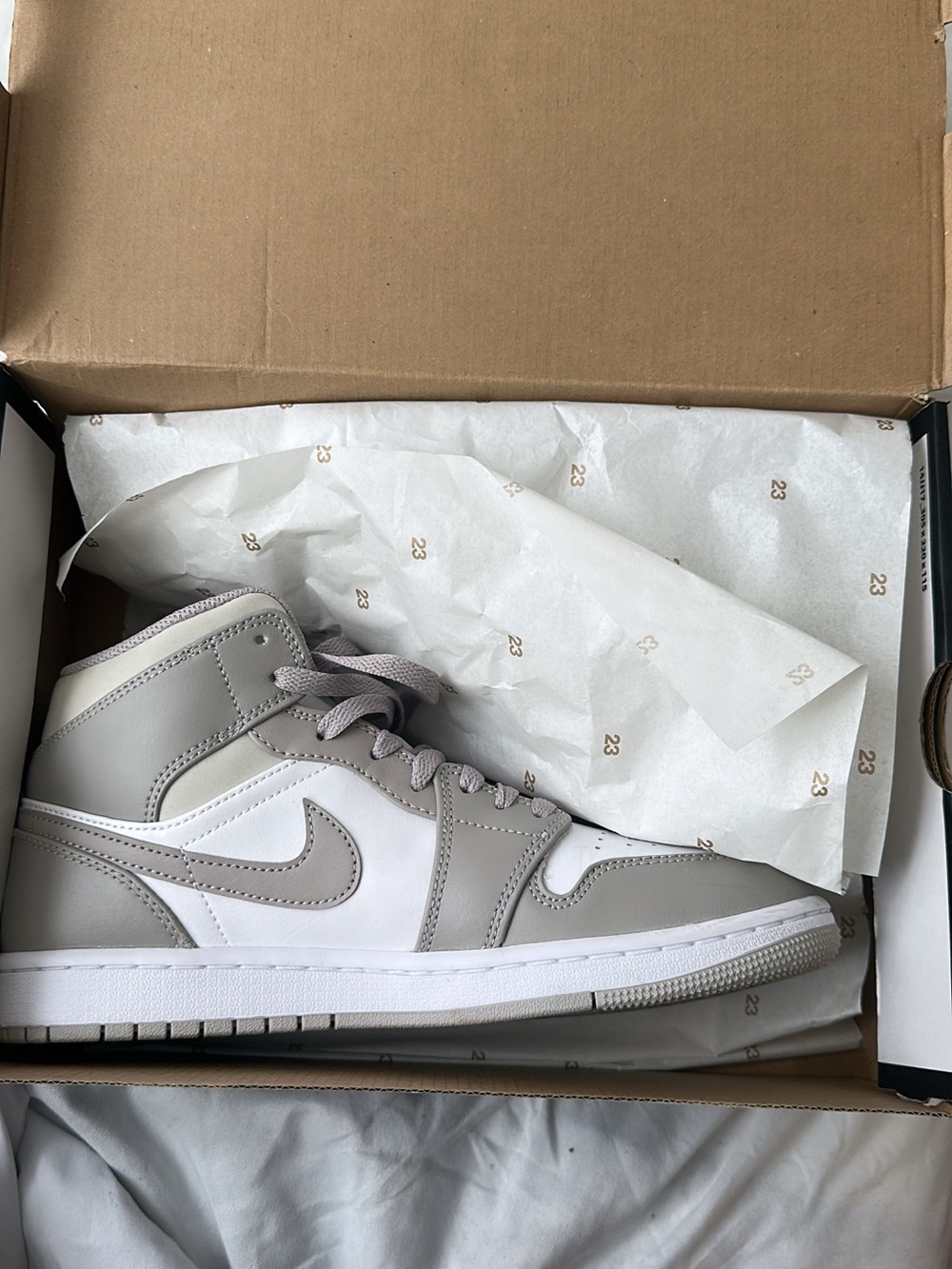 Jordan 1 Mid Sneakers in College Gray and Light Bone White